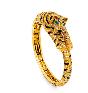Yellow diamond, onyx and emerald bangle bracelet by Cartier.